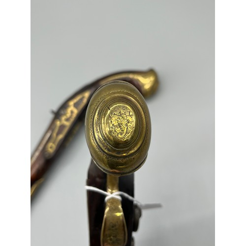 145 - A Pair of 18th/ 19th century Percussion Cap duelling pistols. Marked No.9 to each of the brass carto... 