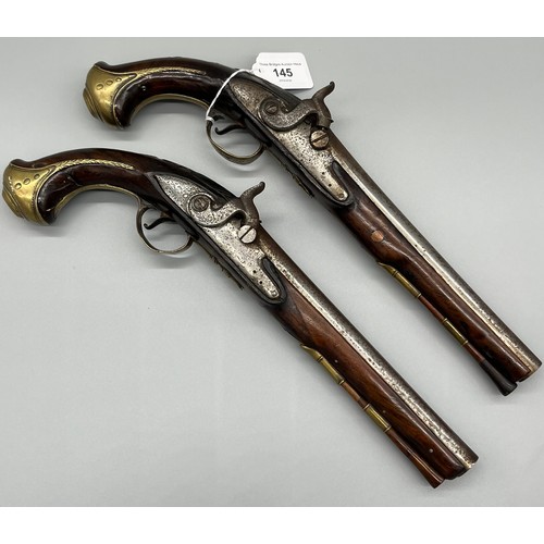 145 - A Pair of 18th/ 19th century Percussion Cap duelling pistols. Marked No.9 to each of the brass carto... 