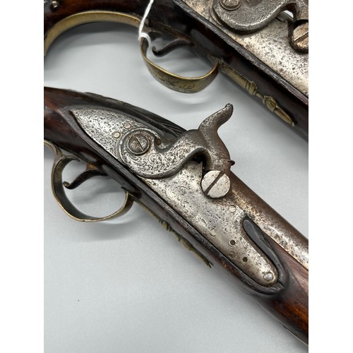 145 - A Pair of 18th/ 19th century Percussion Cap duelling pistols. Marked No.9 to each of the brass carto... 