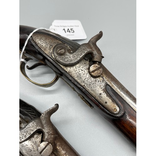 145 - A Pair of 18th/ 19th century Percussion Cap duelling pistols. Marked No.9 to each of the brass carto... 