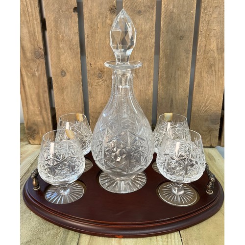 250 - Edinburgh crystal decanter with four matching brandy glasses and serving tray.