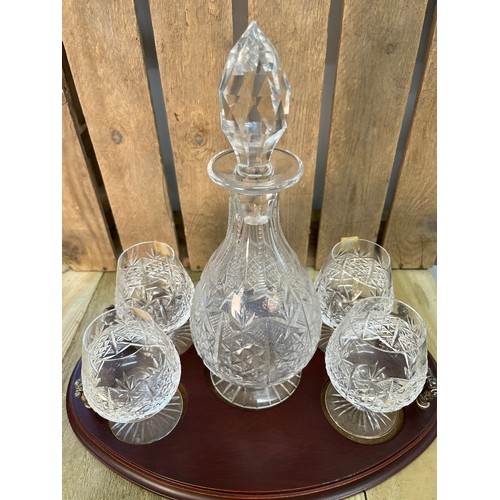 250 - Edinburgh crystal decanter with four matching brandy glasses and serving tray.