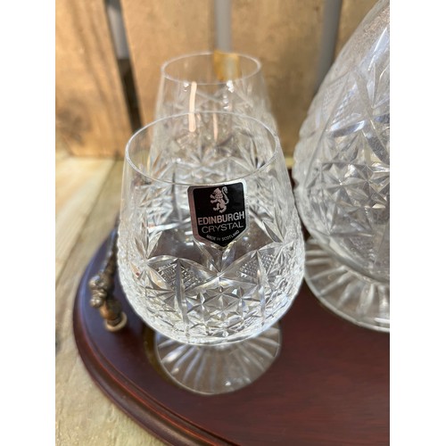 250 - Edinburgh crystal decanter with four matching brandy glasses and serving tray.