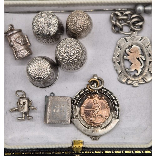 219 - A Selection of silver marked items; Two silver thimbles, Two white metal, Two Silver fob medals, Thr... 