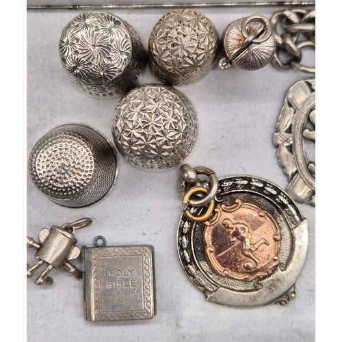 219 - A Selection of silver marked items; Two silver thimbles, Two white metal, Two Silver fob medals, Thr... 