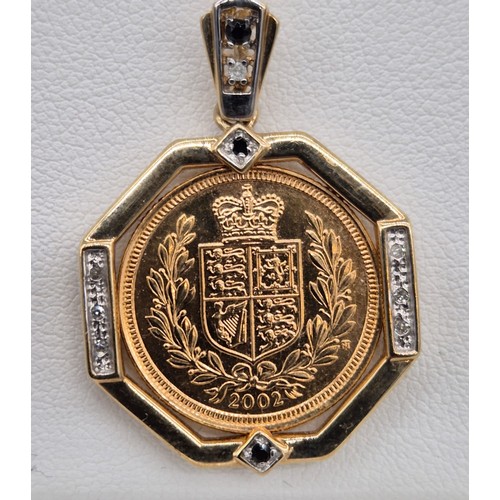 62 - A 2002 Half sovereign in a 9ct yellow gold mount formed as a pendant, with white & black diamonds, t... 