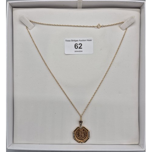 62 - A 2002 Half sovereign in a 9ct yellow gold mount formed as a pendant, with white & black diamonds, t... 