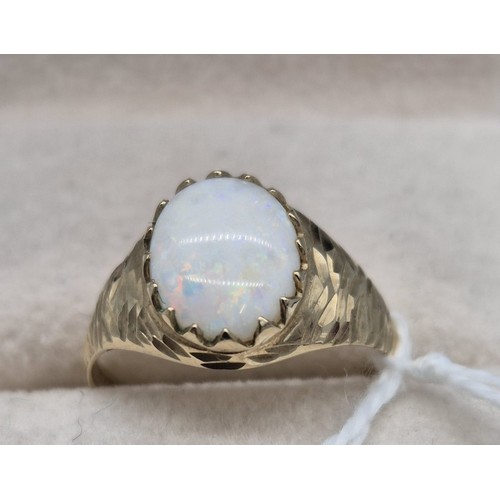 210 - 9ct yellow gold and oval cut opal gem stone ring. [Ring size Q] [2Grams]