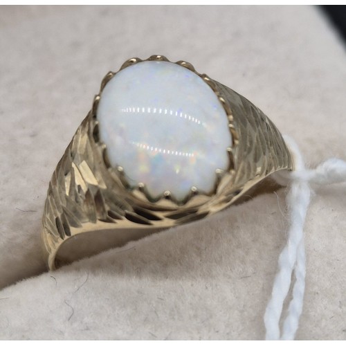 210 - 9ct yellow gold and oval cut opal gem stone ring. [Ring size Q] [2Grams]