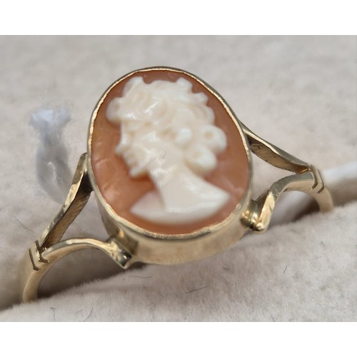 212 - 9ct yellow gold ring set with a carved cameo. [Ring size O 1/2] [1.42Grams]