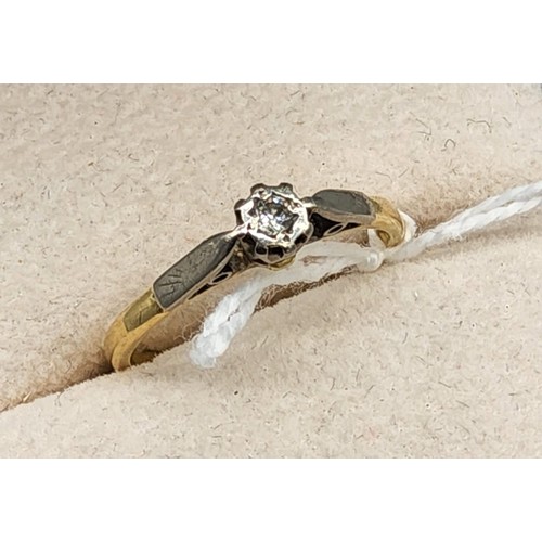 213 - 18ct yellow gold and platinum single diamond ring. [Ring size R] [2.65Grams]