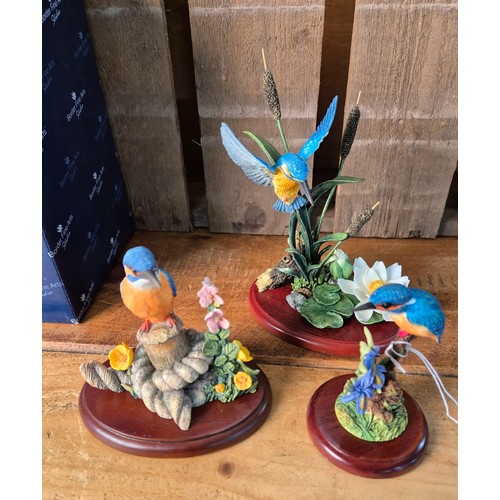 411 - Three boxed border fine arts bird sculptures; 