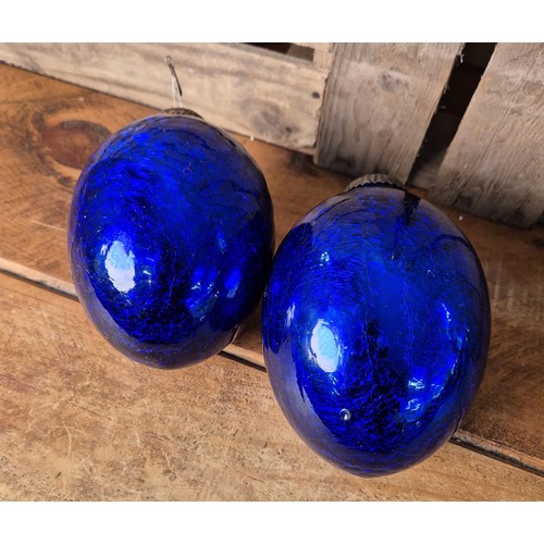 418 - A Pair of Victorian blown blue glass egg shaped Kugel bell bobbles. [15cm high]