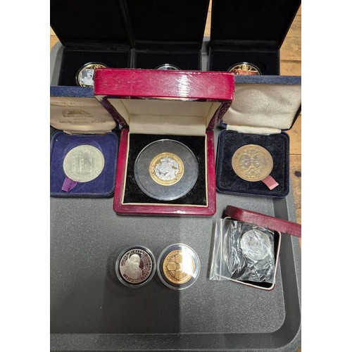 17 - A Collection of boxed mint coins; Royal Naval £5 commemorative coin, The Road to Victory coins and R... 