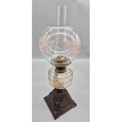 156 - Victorian table top oil lamp; Glass funnel and globe leading to a brass burner and glass shaped body... 