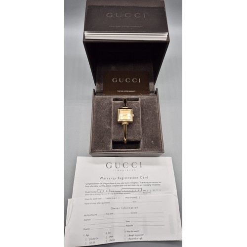 5 - Vintage Ladies Gucci 1900L Gold Plated Bangle watch. Comes with box and certificate card.