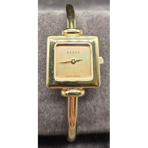 5 - Vintage Ladies Gucci 1900L Gold Plated Bangle watch. Comes with box and certificate card.