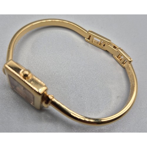 5 - Vintage Ladies Gucci 1900L Gold Plated Bangle watch. Comes with box and certificate card.