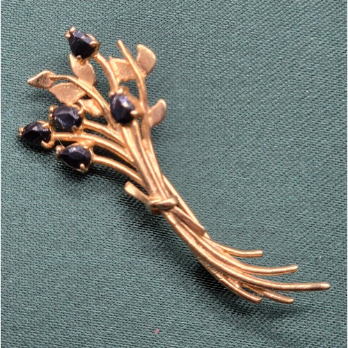 10 - 9ct yellow gold brooch fitted with five pear drop cut Sapphire gem stones. [2.90grams]