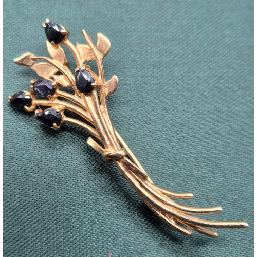 10 - 9ct yellow gold brooch fitted with five pear drop cut Sapphire gem stones. [2.90grams]