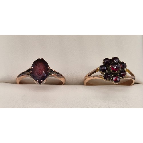 21 - Two 9ct rose gold and red glass stones rings. [Ring size L & M] [3.90grams]