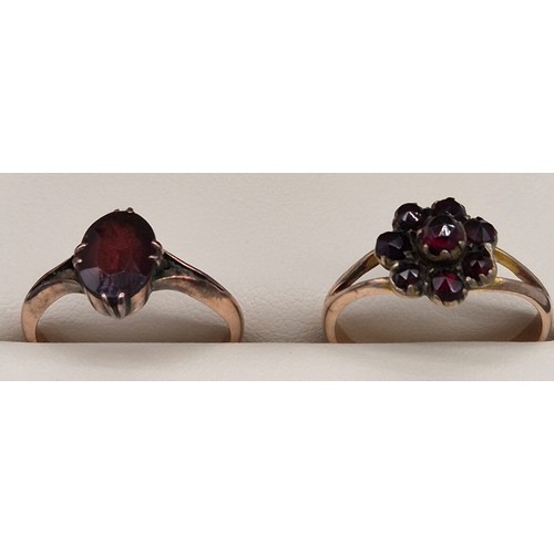 21 - Two 9ct rose gold and red glass stones rings. [Ring size L & M] [3.90grams]