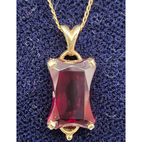 29 - 14ct yellow gold and large usual cut Ruby Gem stone pendant together with a 14ct yellow gold chain. ... 