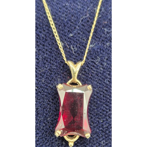 29 - 14ct yellow gold and large usual cut Ruby Gem stone pendant together with a 14ct yellow gold chain. ... 