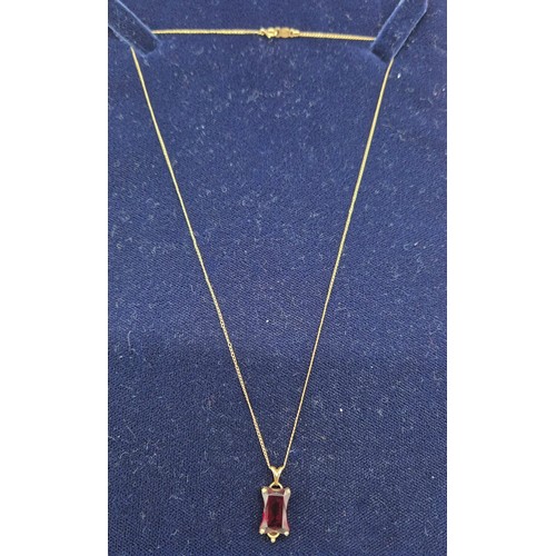 29 - 14ct yellow gold and large usual cut Ruby Gem stone pendant together with a 14ct yellow gold chain. ... 