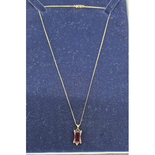 29 - 14ct yellow gold and large usual cut Ruby Gem stone pendant together with a 14ct yellow gold chain. ... 