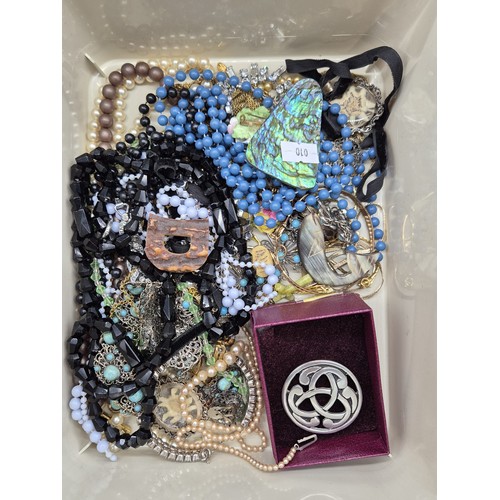 36 - Two small tubs of mixed costume jewellery; Sweetheart R.A.F Brooch and Pendant, Sarah Coventry neckl... 