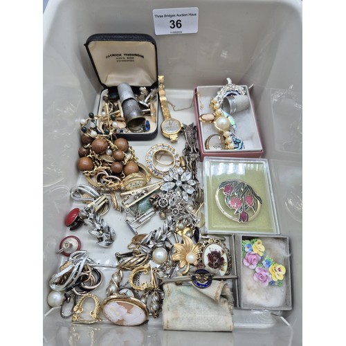 36 - Two small tubs of mixed costume jewellery; Sweetheart R.A.F Brooch and Pendant, Sarah Coventry neckl... 