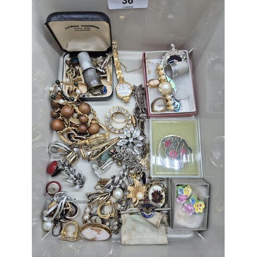 36 - Two small tubs of mixed costume jewellery; Sweetheart R.A.F Brooch and Pendant, Sarah Coventry neckl... 