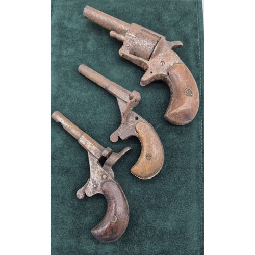 174 - Three various 19th century Muff Guns. One marked Robin Hood No1.