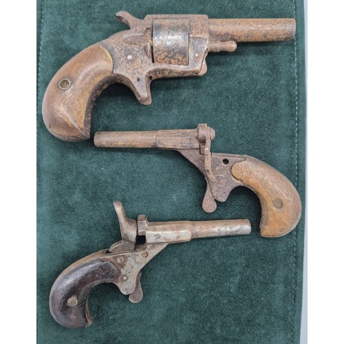 174 - Three various 19th century Muff Guns. One marked Robin Hood No1.