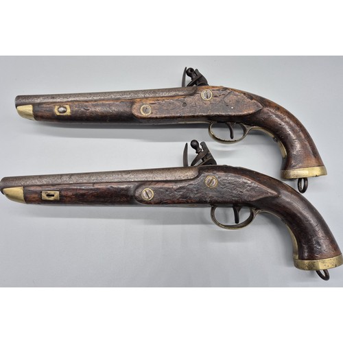 183 - A Pair of 19th century East Indian Company flint lock pistols. Mahogany bodies, Steel and brass fitm... 