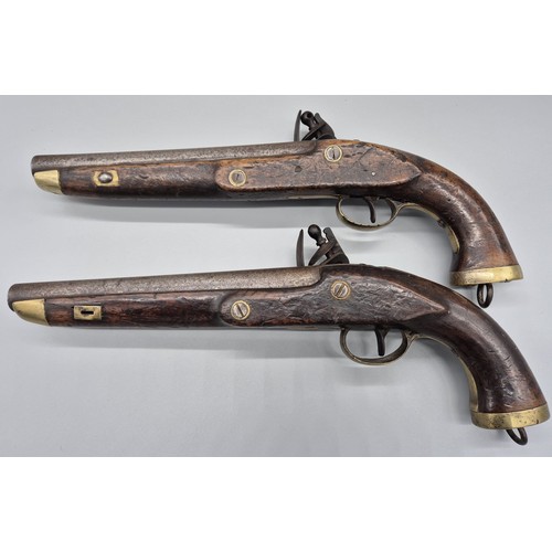 183 - A Pair of 19th century East Indian Company flint lock pistols. Mahogany bodies, Steel and brass fitm... 