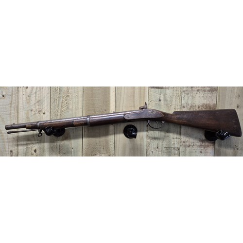 185 - 19th century cap rifle. Mahogany body and steel barrel and mechanism. Comes with original loading ro... 