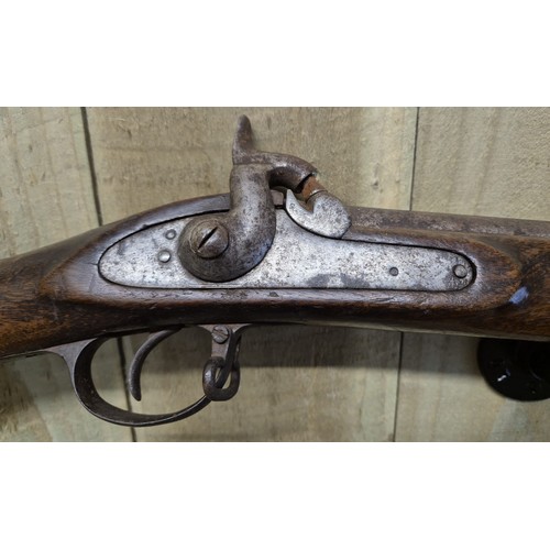 185 - 19th century cap rifle. Mahogany body and steel barrel and mechanism. Comes with original loading ro... 