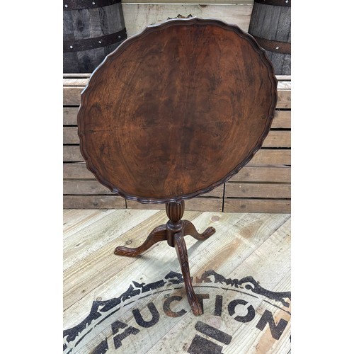 301 - Antique mahogany drop end wine table; Pie crust edge, raised on carved tri legs and single turned co... 