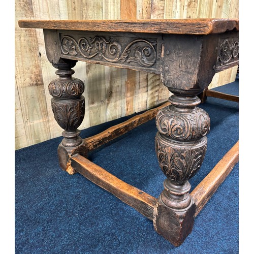 302 - 17th/ 18th century Solid oak Jacobean dining table. Rectangle top leading to carved under trim and r... 