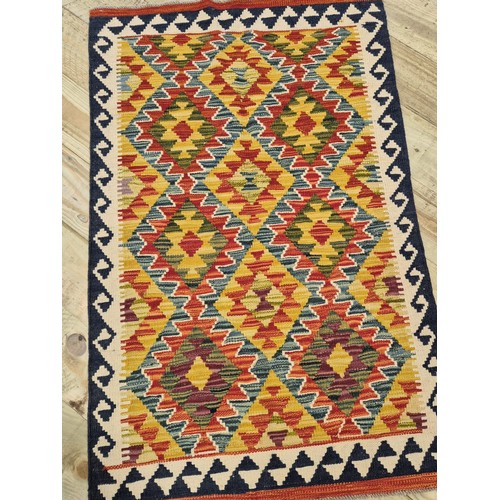 335 - Hand knotted Chobi kilim rug. [127x81cm]