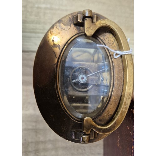 390 - Antique French single barrel brass and bevel glass carriage clock. Comes with leather travel case.