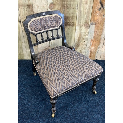 346 - Edwardian ebonised nursing chair. pad back and cushioned area. Raised on turned shaped legs and bras... 