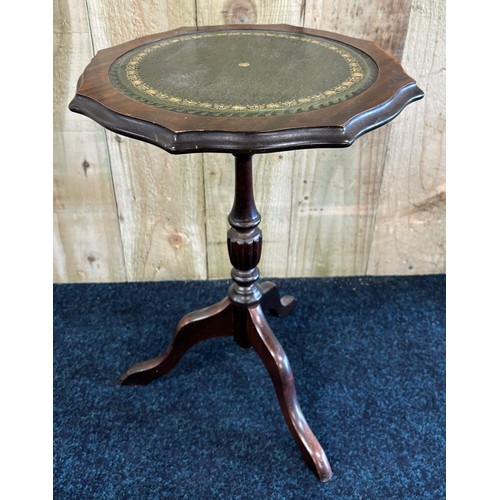 455 - Reproduction wine table fitted with green leather top. [50x37cm]