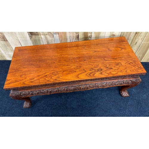 451 - Chinese hardwood coffee table, hand carved legs and trims. [51x122x49cm]