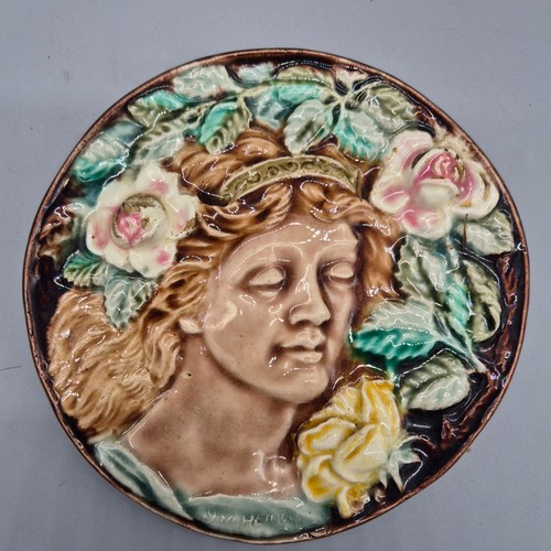 443 - Antique Majolica wall plaque of circle form depicting a portrait of a woman surrounded by roses and ... 