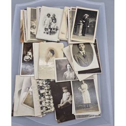 438 - A Tray of antique family portrait postcards.