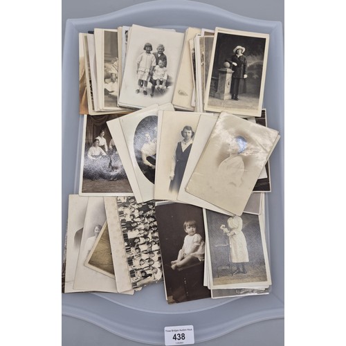 438 - A Tray of antique family portrait postcards.