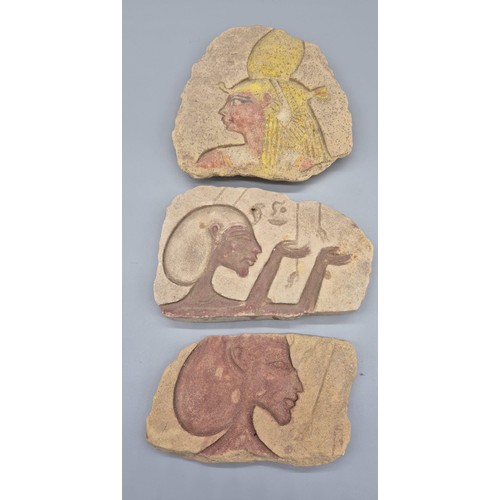 436 - Three carved Egyptian sandstone pieces with Ancient Egyptian designs. [Large piece- 24x23cm]